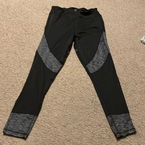 Polyester/spandex legging. Black with textured grey areas at thigh and ankle
